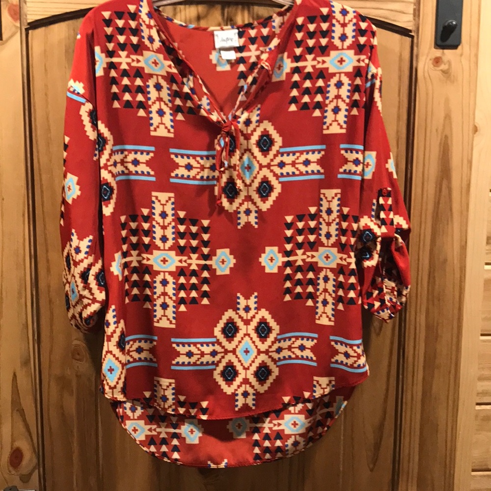 Women's rust colored Aztec printed blouse